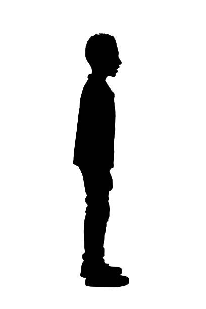 istock silhouette of side view of a boy standing and smiling on white background 2242573825