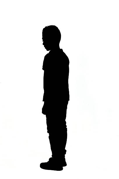 istock silhouette of side view of a boy standing looking away on white background 2242573938