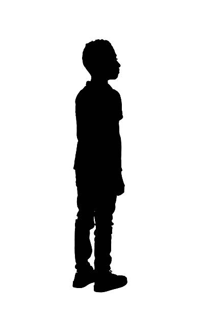 istock silhouette of back, side view of a boy standing looking away on white background 2242573949