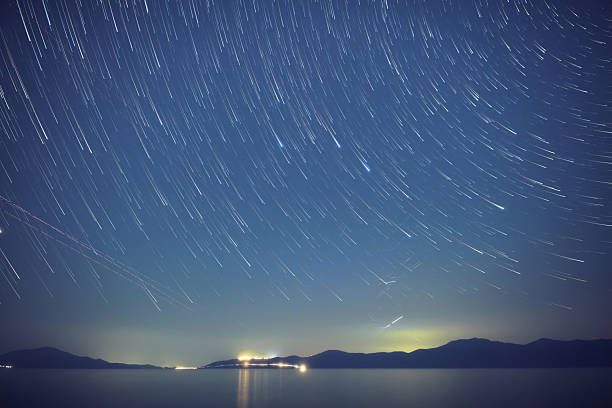 istock Time-lapse startrails over ocean sea waters. 2242574994