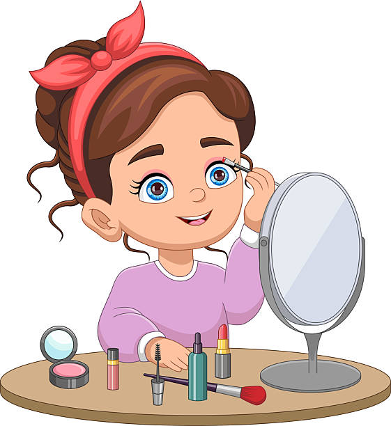 istock Little girl putting on makeup in front of the mirror 2242576938