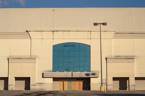 istock Abandoned Commercial Building with Arched Glass Facade 2242578885