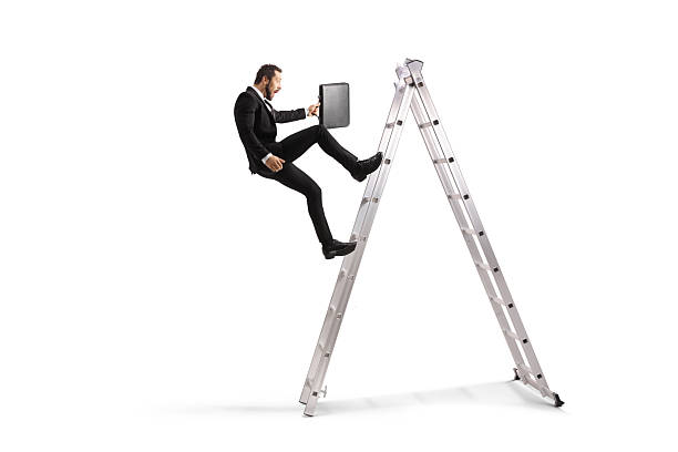 istock Businessman falling from a ladder 2242579325