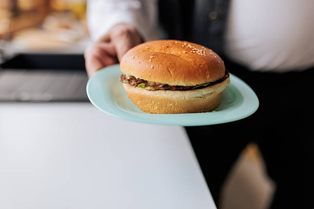 istock Close-Up of Burger on Plate 2242580955