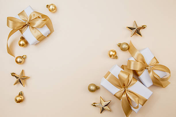 istock Golden gift box composition for Christmas and New Year celebration. Minimal cozy layout with copy space for message or logo. 2242584400