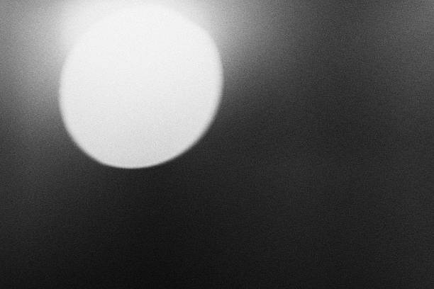 istock black and white shine light leak for background 2242584578