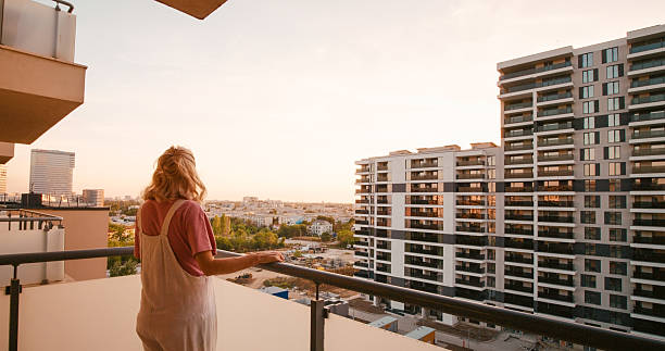 istock Pregnant woman walking on a balcony. 2242588198