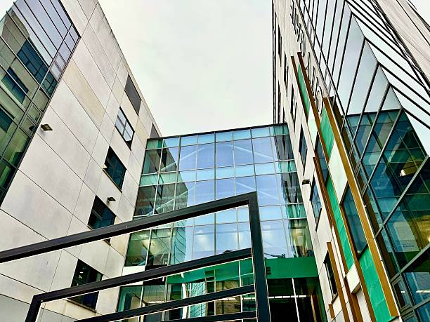 istock Modern urban architecture with green coloured windows with different angles and reflections in the glass at Newcastle Upon Tyne 2242591376