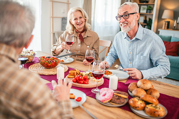 istock Group of senior adults spending quality time together over lunch 2242591447