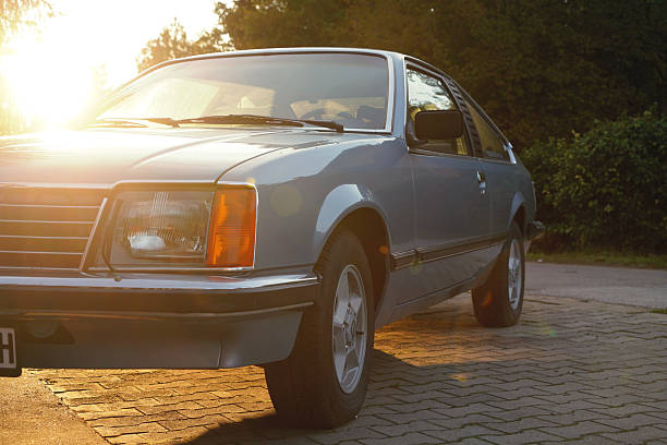 Close-up headlight with wipers of Opel Monza (a1 1st generation 1977-1982, related Vauxhall Royale Coupe, Opel Senator fastback) is parked in Palic, Serbia September, 20 2024