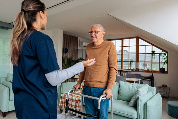 istock Home Nurse Assisting Senior Man During Recovery Visit 2242595611