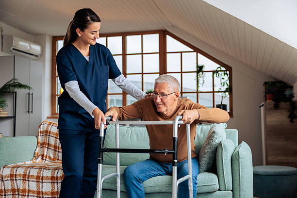 istock Nurse Helping Senior Man Use a Walker 2242596077