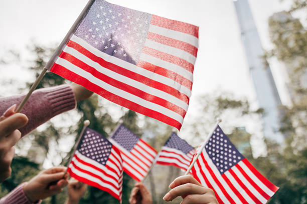 istock Raised American flags at public event symbolizing national pride and freedom 2242596469