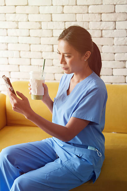 istock Doctors are taking selfies while drinking coffee and relaxing while waiting to examine patients in the hospital. 2242596952