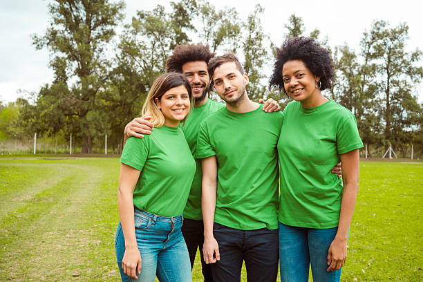 istock Smiling environmentalists in public park 2242597383