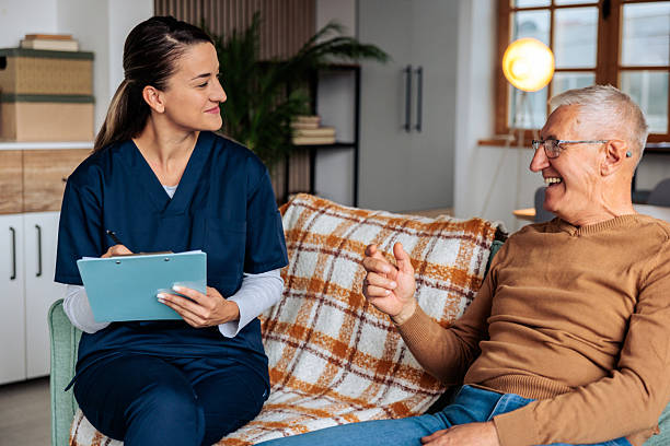 istock Nurse Talking with Senior Patient at Home Visit 2242597672