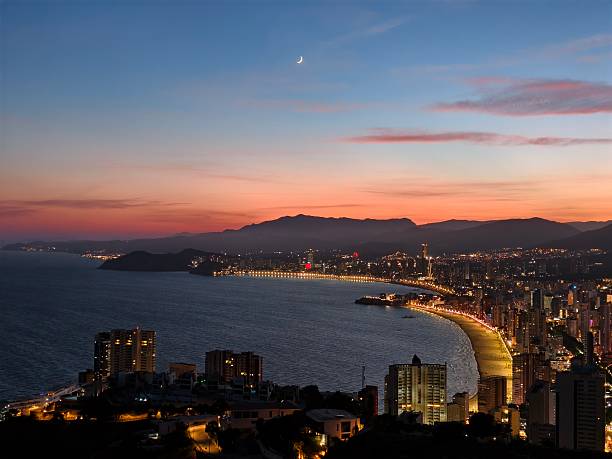 istock nighttime coastal scene, peaceful moonlit coastal bay with glowing shoreline and tranquil waters 2242597886