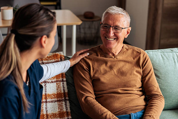 istock Nurse Talking with Senior Man at Home Visit 2242597910