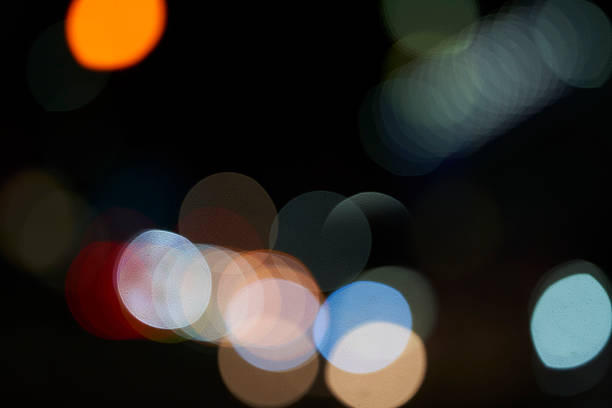 istock Specks of light: Colorful bokeh dancing in the night city 2242600059
