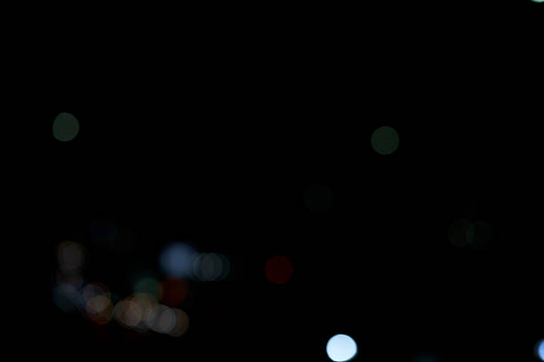 The work poetically captures countless balls of light floating in the darkness as \