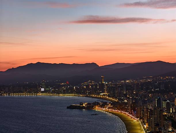 istock stunning coastal panorama, dusklit bay meets mountain range, drone captures serene seaside skyline 2242601417