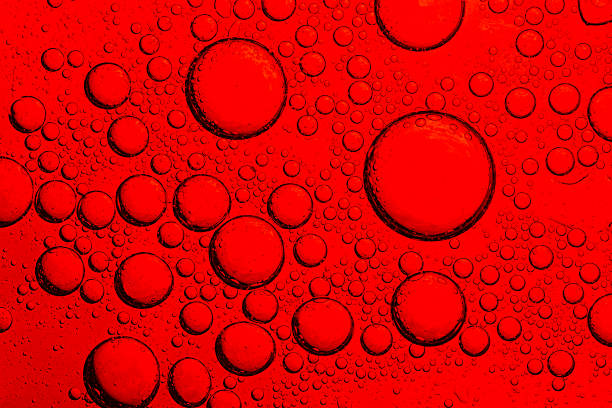istock Close-up of red macro drink bubbles,abstract red wine bubbles, close-up shot,Macro Microscope red bubble texture close-up blood liquid, red macro bubbles Backgrounds red water drops on glass 2242602451