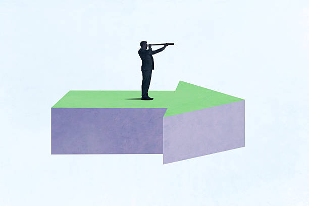 istock Man Standing On Arrow Looks Through Spyglass 2242602771