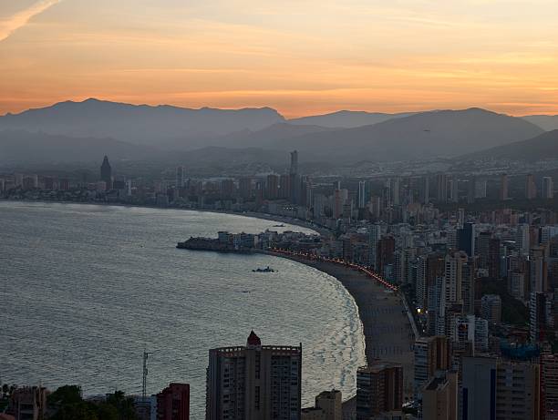 istock hazy evening skyline with shimmering reflections, softly lit dusk with distant city lights and calm 2242606522