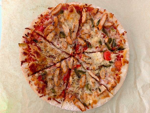 2 Slices of Pizza on a Black Plate
