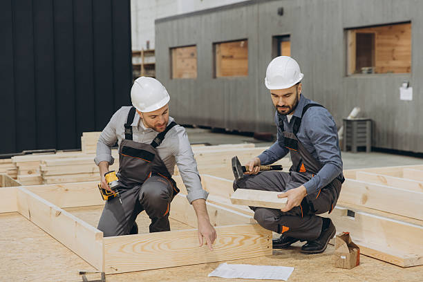 istock Carpenters building wooden frame in workshop for modular house 2242609133