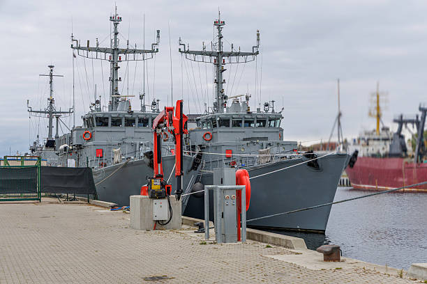 istock Two Grey Military Ships Docked at a Port 2242610136