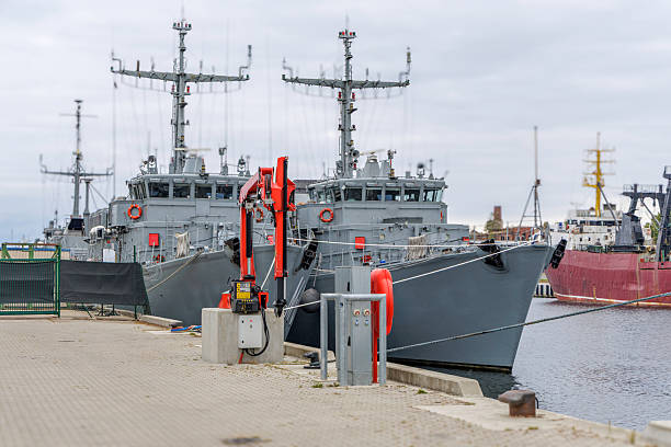 istock Two Grey Military Ships Docked at a Port 2242610161