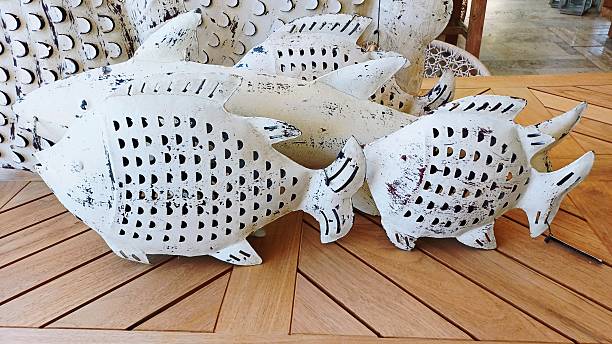 Decorative wooden figurines in the shape of fish.