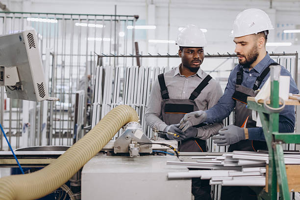 istock Factory workers discussing aluminum window and door production 2242625037