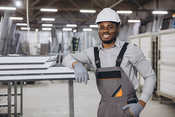 istock Factory worker posing near aluminum window and door frames 2242625313