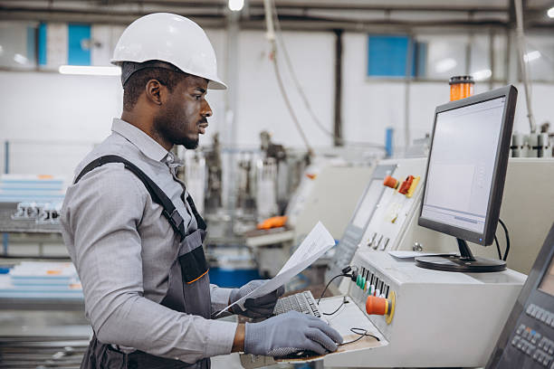 istock Factory worker operating machinery for aluminum and PVC windows and doors production 2242625375