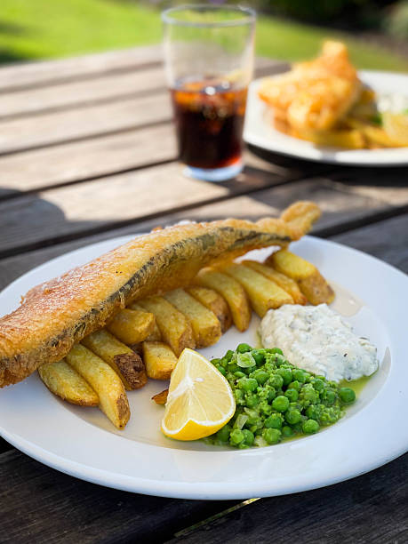 London UK, September 03 2025, Breaded Cod Fish Fillet With Boiled New Potatoes And Mushy Peas With No People