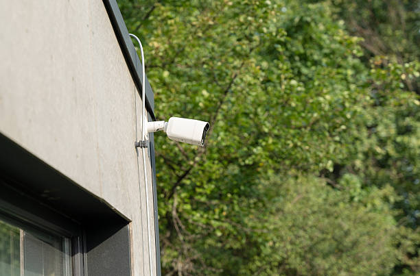 istock Outdoor security camera. CCTV surveillance camera mounted on modern building wall. Security and safety technology for home or business protection. 2242628530