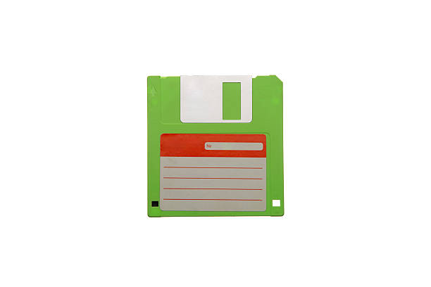 istock Single vintage green 3.5-inch floppy disk isolated on white 2242629160