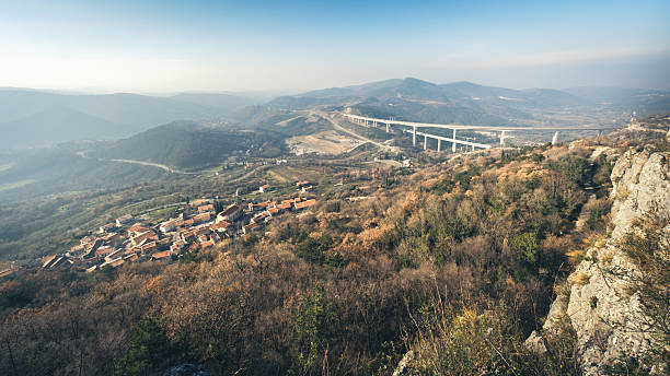 Millau, France: Detailed perspective of Millau Viaduct in France, showcasing its modern cable-stayed design and massive pillars.