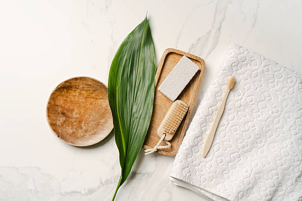 istock Natural spa composition with eco accessories, green leaf, and towel on marble background. Minimal concept for wellness, beauty, and skincare product presentation. 2242630727