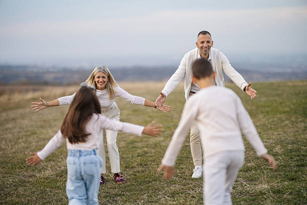 Family jump at sunset
