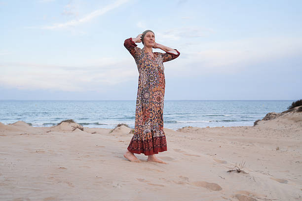 istock Woman with cancer finding hope and peace on beach 2242635663