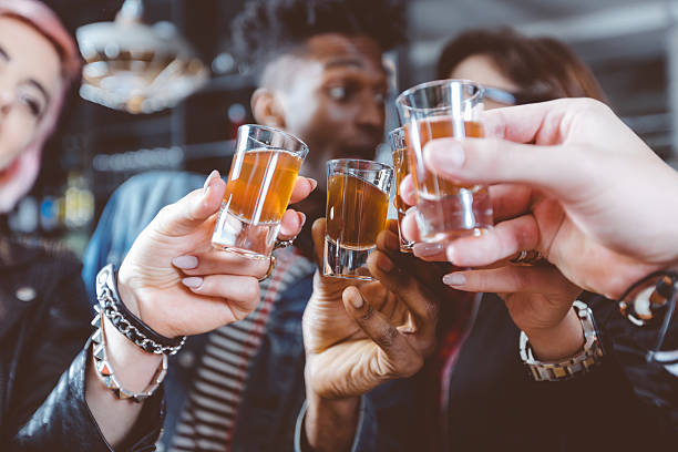 istock Happy friends drinking shots 2242641884