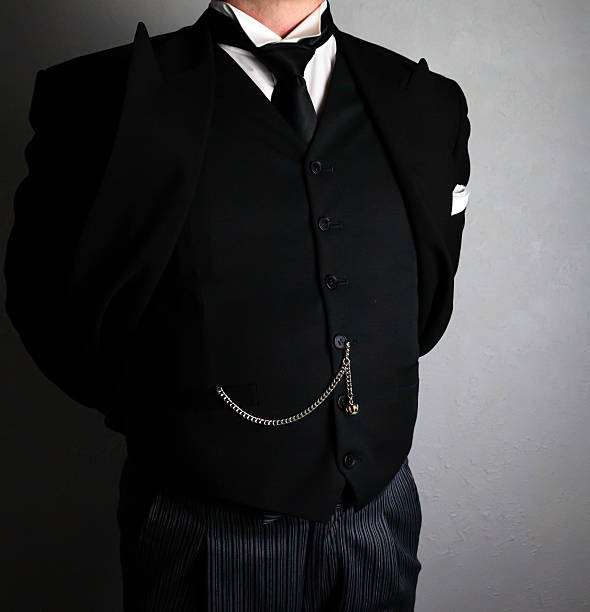 istock Butler Standing With Hands Behind Back in Dignified Manner 2242644075