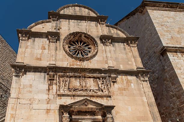 istock Stone church facade with rose window 2242646033