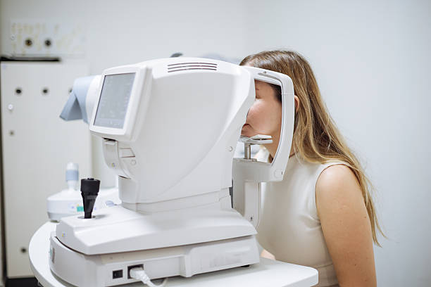 istock Beautiful  woman during her annual eye test check-up 2242649660