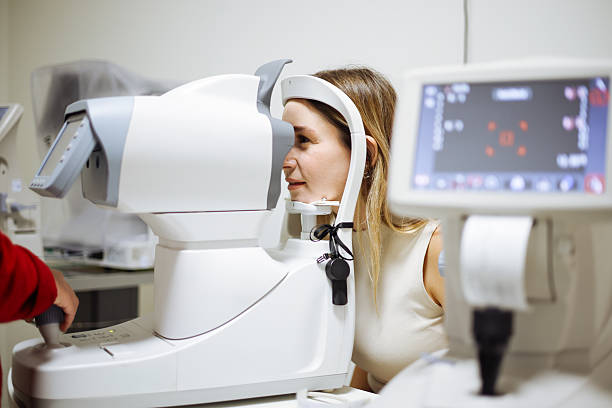 istock Beautiful  woman during her annual eye test check-up 2242650212
