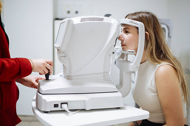 istock Beautiful  woman during her annual eye test check-up 2242650484