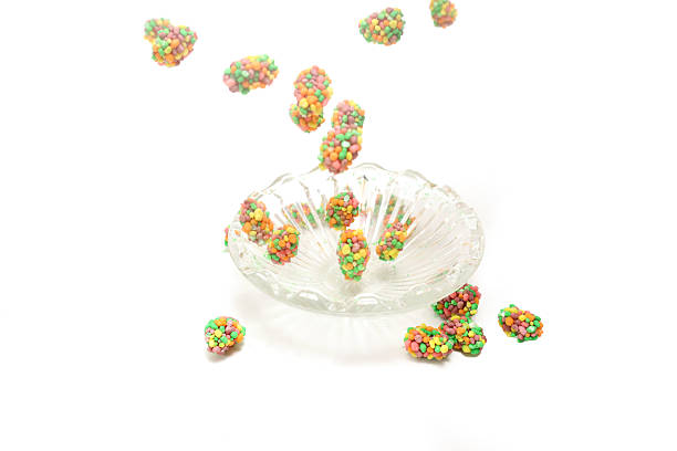 Colorful gummies with sprinkles in scattering isolated on a white background.